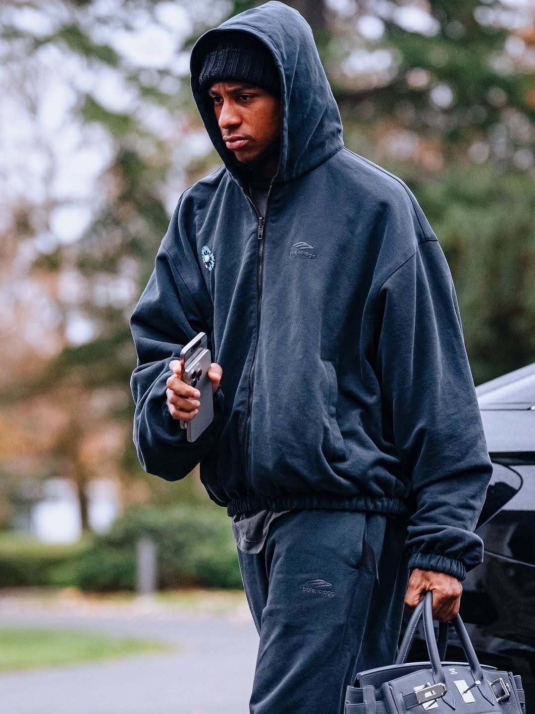 Photo by MichaelOlise on November 11, 2025. May be an image of sweatshirt, sweatpants, fleece, sportswear, sweatsuit, parka and text.