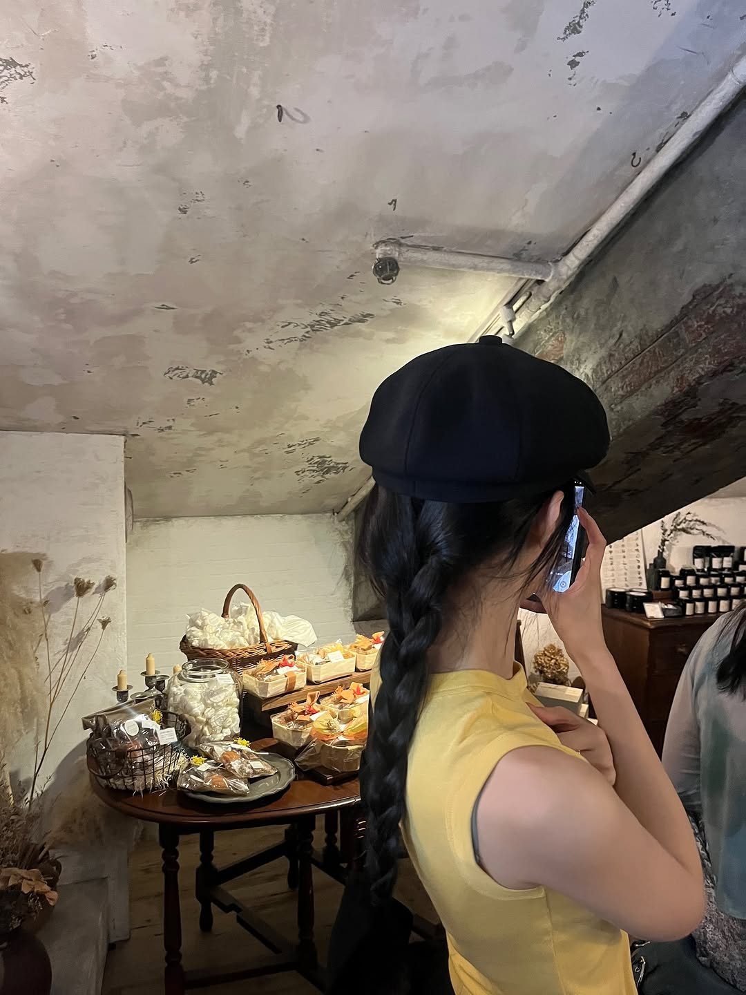 Photo by MUN KA YOUNG on October 25, 2025. May be an image of phone, bowler hat, beret and text.