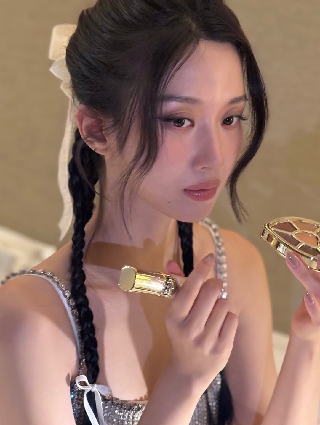 Photo shared by MUN KA YOUNG on September 28, 2025 tagging @dolcegabbana_beauty, and @mister.gabbana. May be an image of 1 person, braids, makeup, slip, sleepwear, chemise and text.