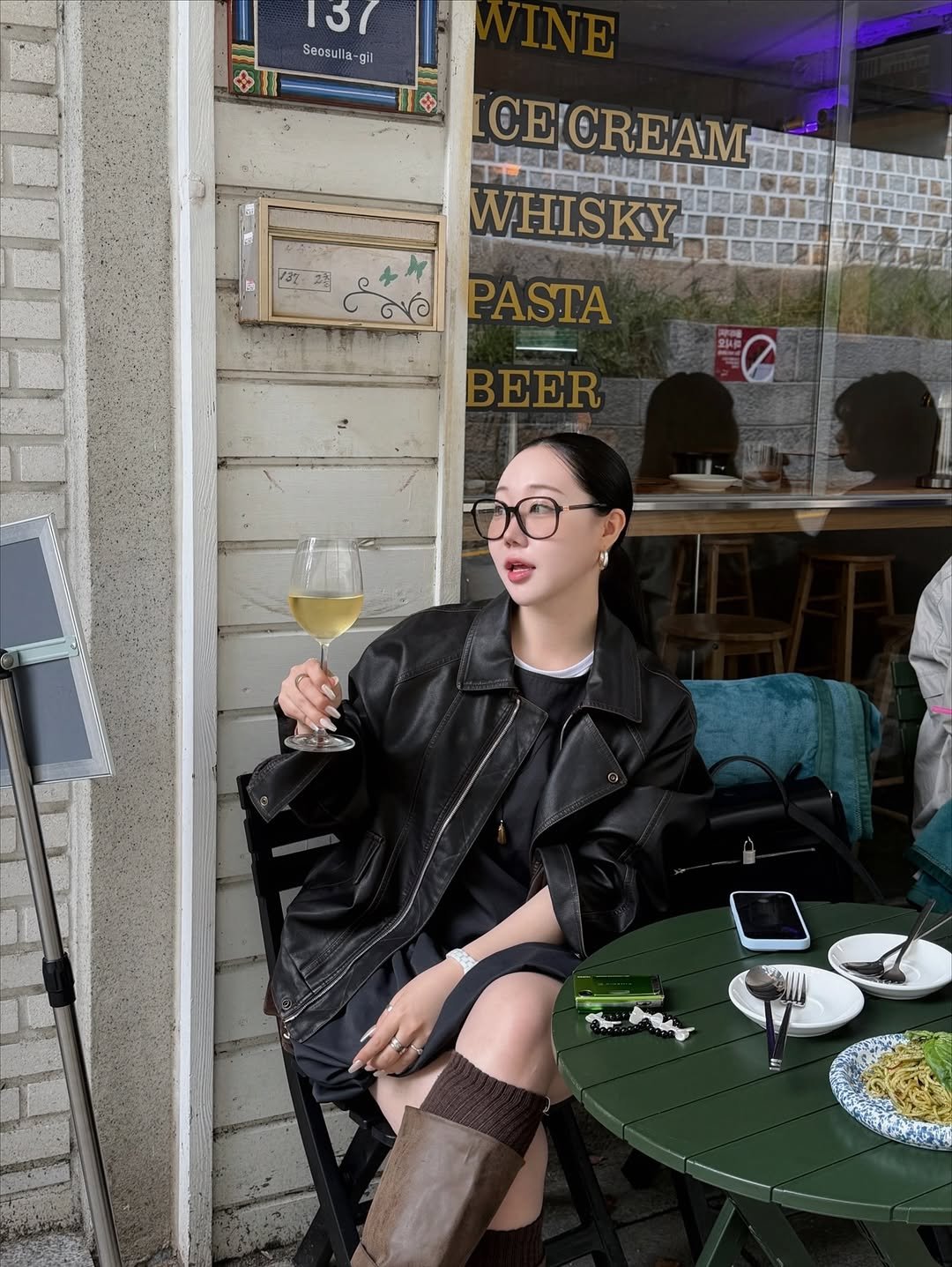 Photo by 하비언니 최민지 on October 14, 2025. May be an image of eyewear, overcoat, drink and text.