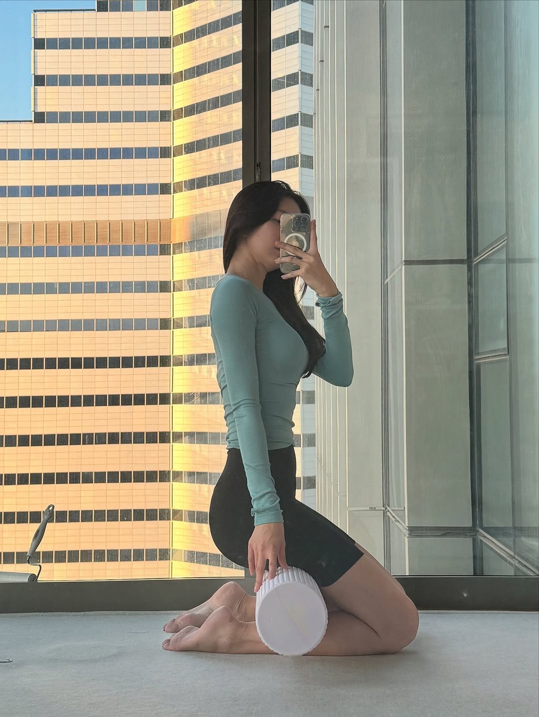 Photo by 매그니유/ GYURI 규리 on August 15, 2025. May be an image of 1 person, activewear, skyscraper and text.