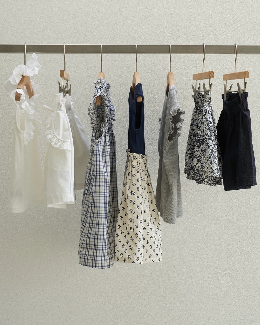 Photo by 마망블랑 mamanblanc on April 20, 2026. May be an image of clothes hanger, rack and text.