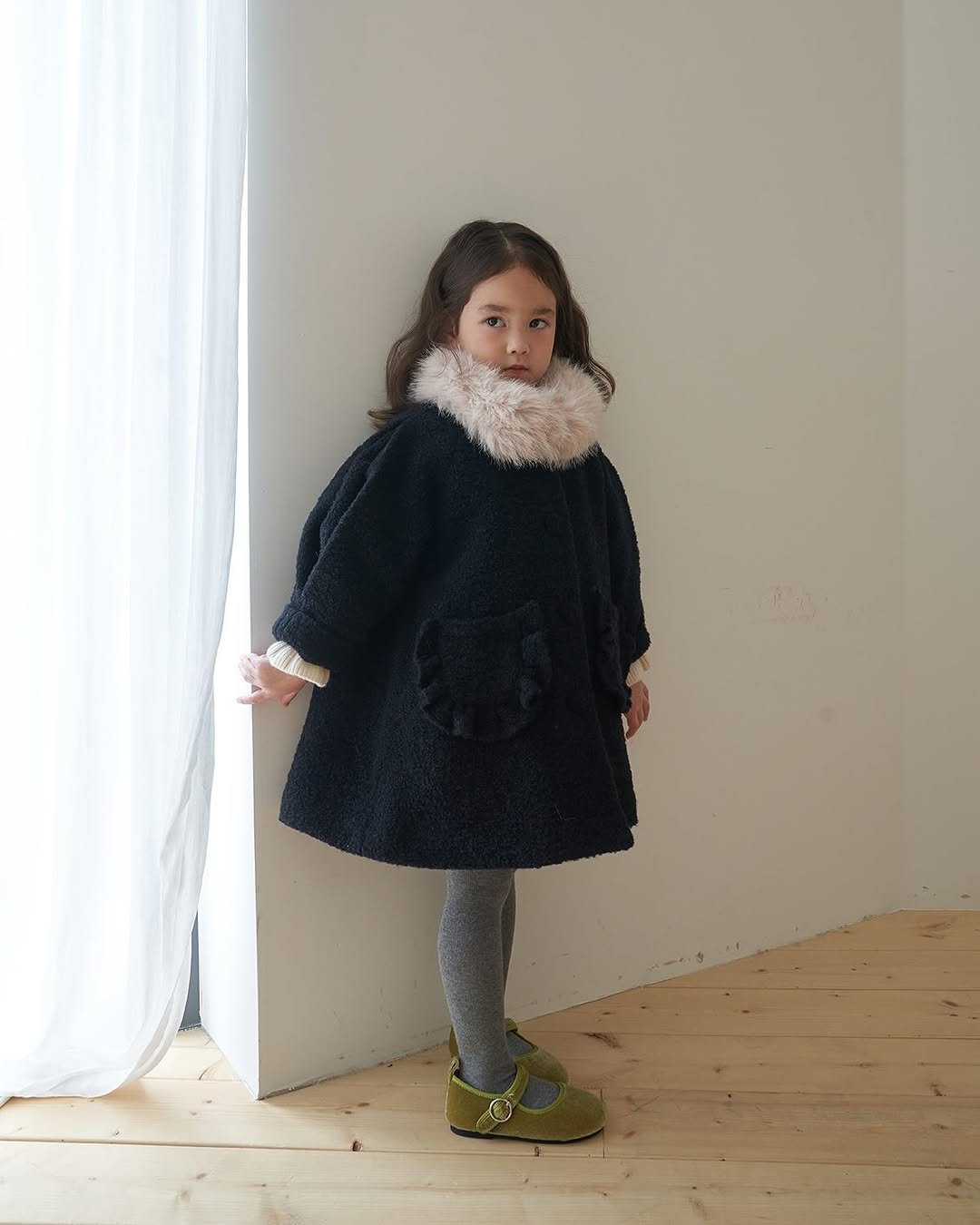 Photo by 마망블랑 mamanblanc on September 29, 2025. May be an image of 1 person, duffle coat, sable coat and text.