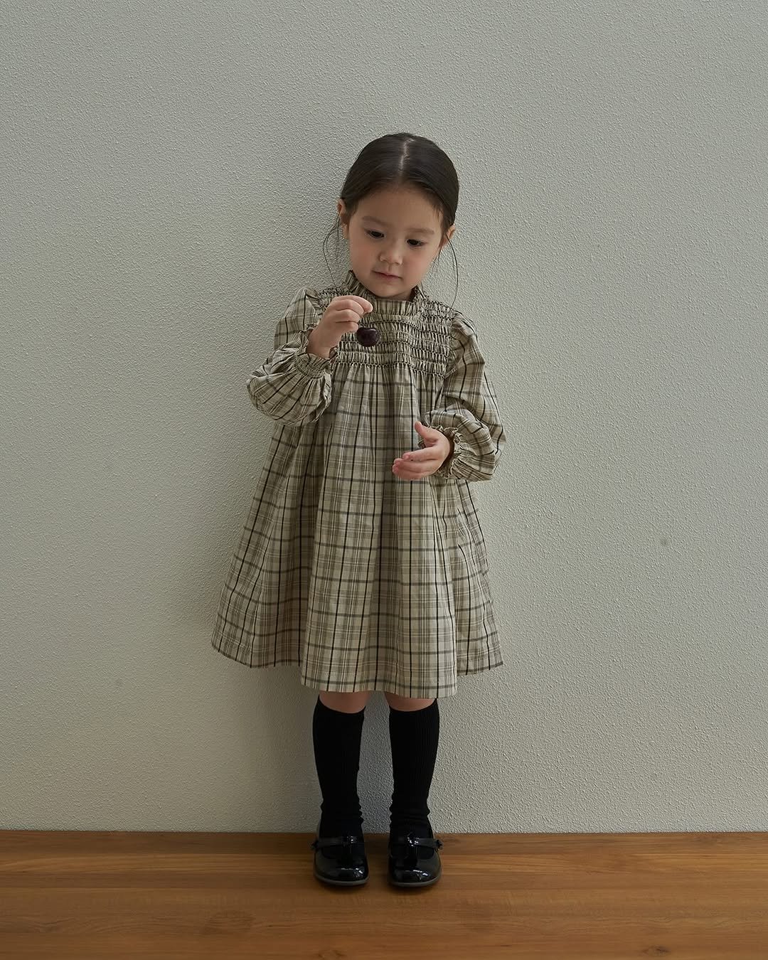 Photo by 마망블랑 mamanblanc on September 02, 2025. May be an image of 1 person, baby, duffle coat, overcoat, dress and text.