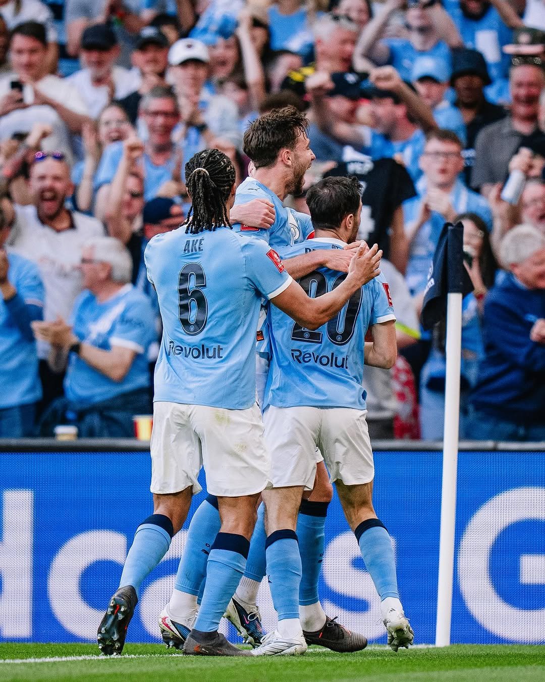 Photo by Manchester City in Wembley Stadium. May be an image of soccer, football, stadium and text that says 'AKE Vevolut Revolut'.