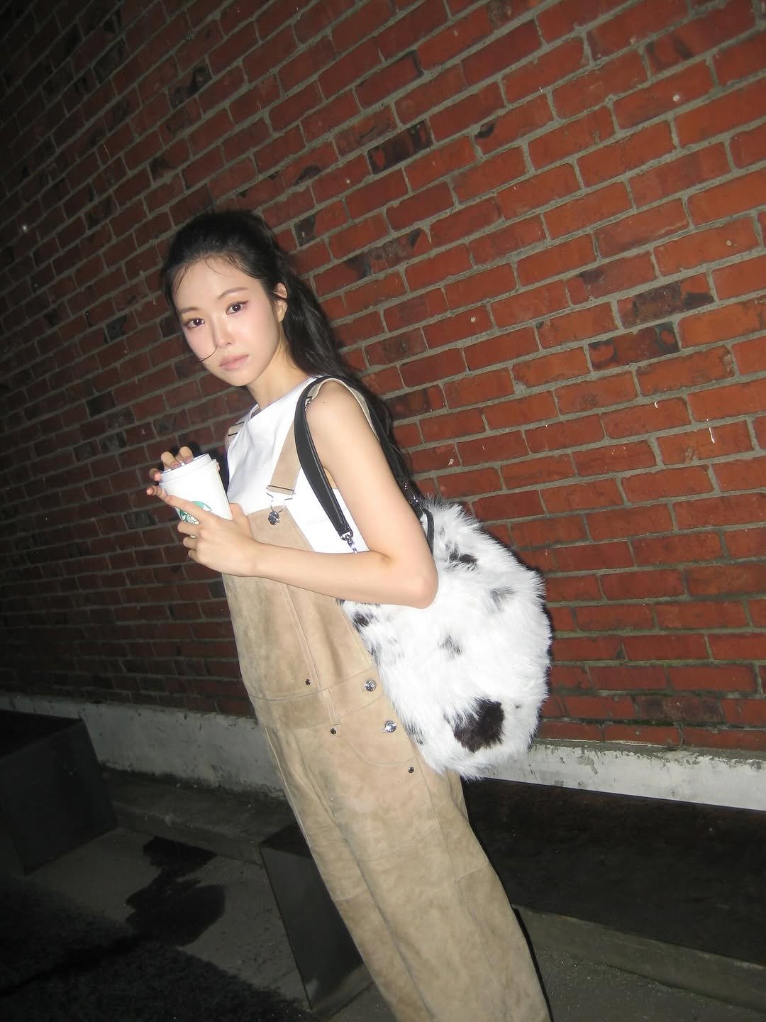 Photo shared by sonnaeun on September 30, 2025 tagging @longchamp. May be an image of purse, fur and text.