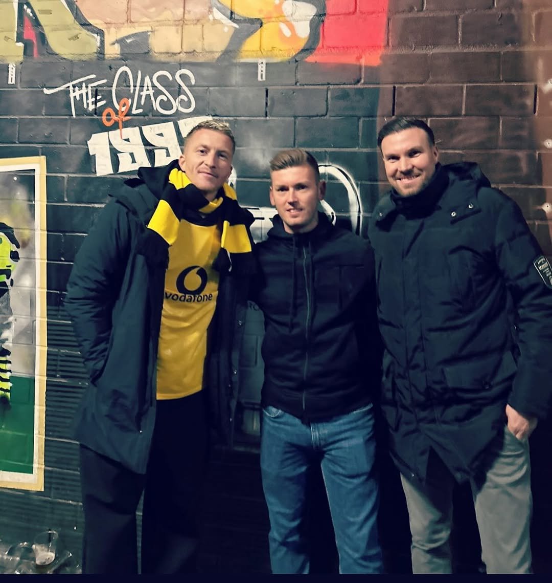 Photo shared by Kevin Großkreutz on December 10, 2025 tagging @marcinho11, @bvb09, and @matu_chris. May be an image of one or more people, parka and text that says 'MEGLASS 1996'.