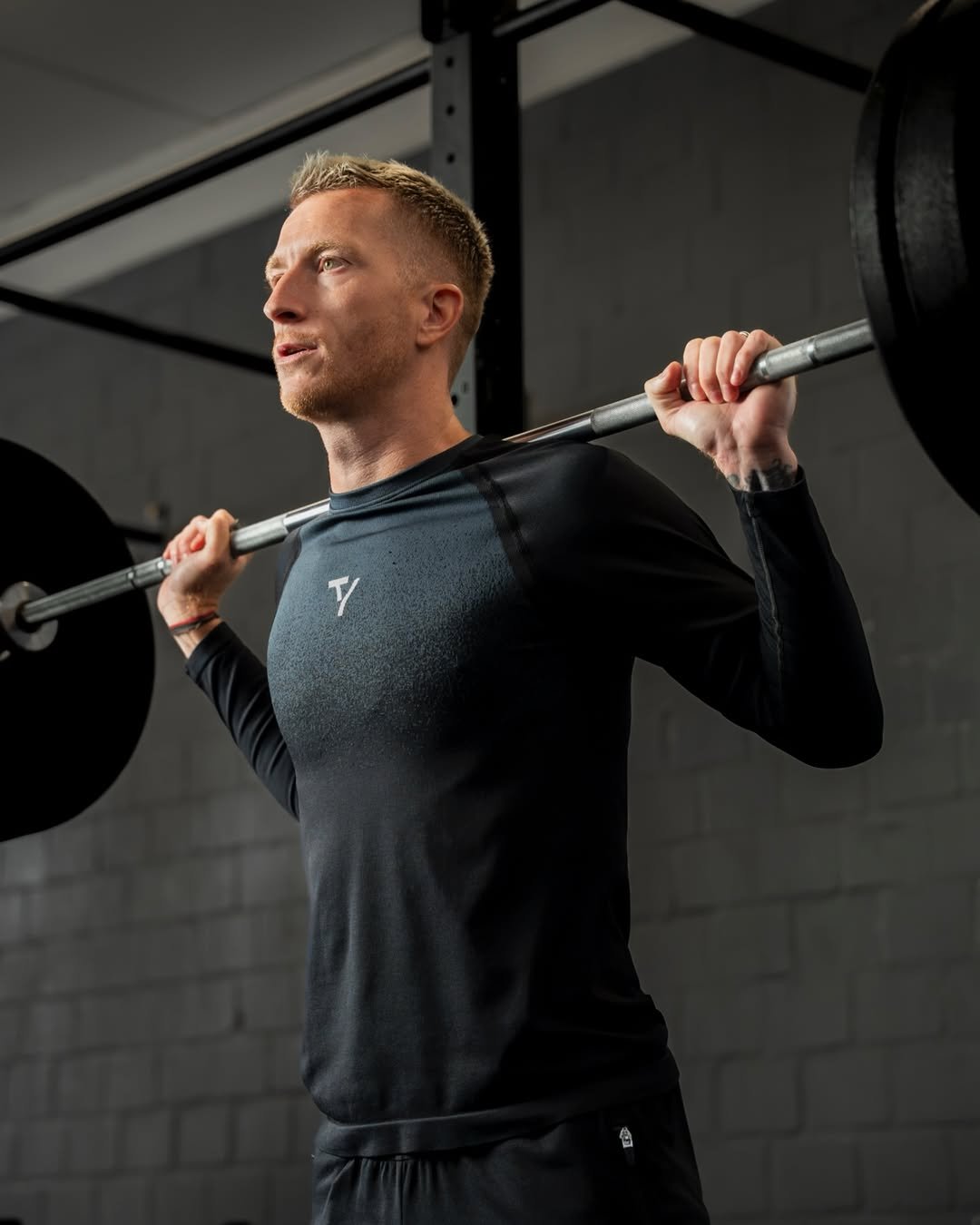 Photo shared by Marco Reus on January 03, 2026 tagging @teveo. May be an image of activewear, dumbbell, sportswear, barbell and text.