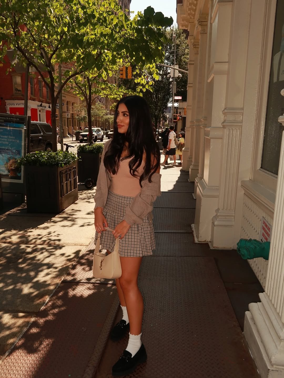 Photo shared by Maria Aiello on September 13, 2025 tagging @themariaaiello. May be an image of miniskirt, street and text.