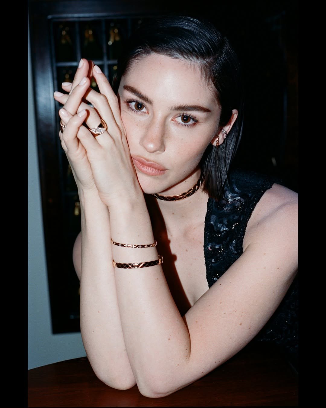 Photo shared by marie claire korea 마리끌레르 on January 15, 2026 tagging @gracieabrams, and @chanelofficial. May be an image of one or more people, makeup, people smoking, bangle, choker and text.