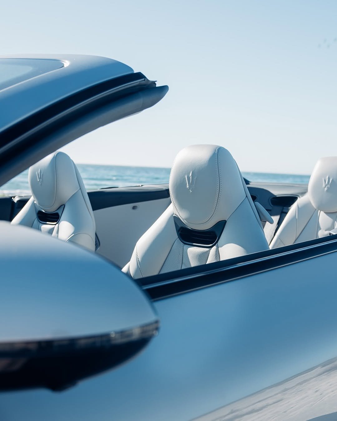 Photo by Maserati on August 29, 2025. May be an image of car, rearview mirror, convertible, roadster and text.