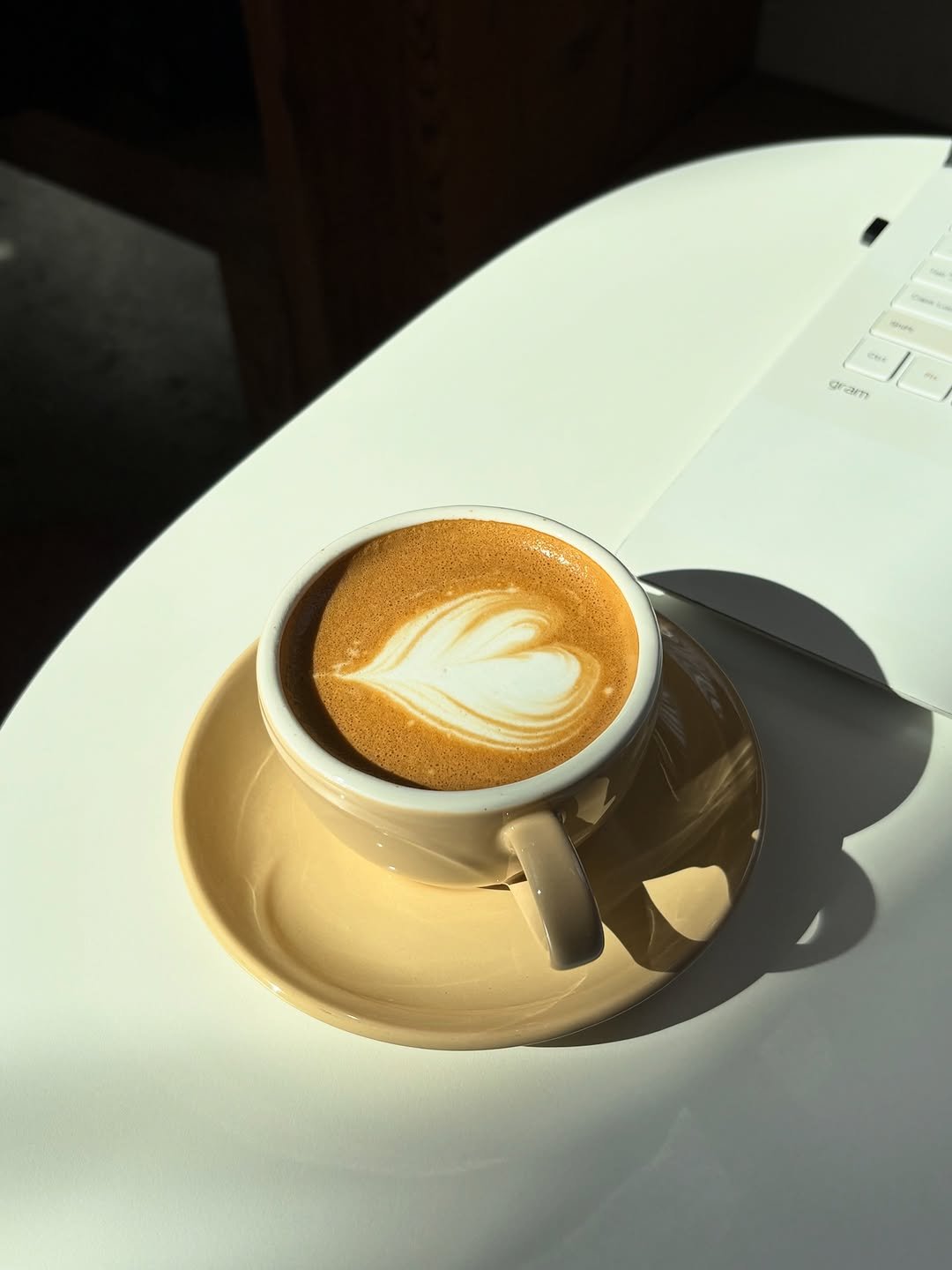 Photo by 은지 on December 24, 2025. May be an image of coffee cup, coffee, cup, saucer, cappuccino, cornflower and text.