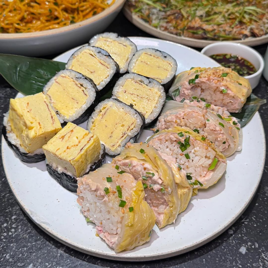 Photo by 스포일러 on April 18, 2026. May be an image of tofu, chow mein, noodles, sushi and text.