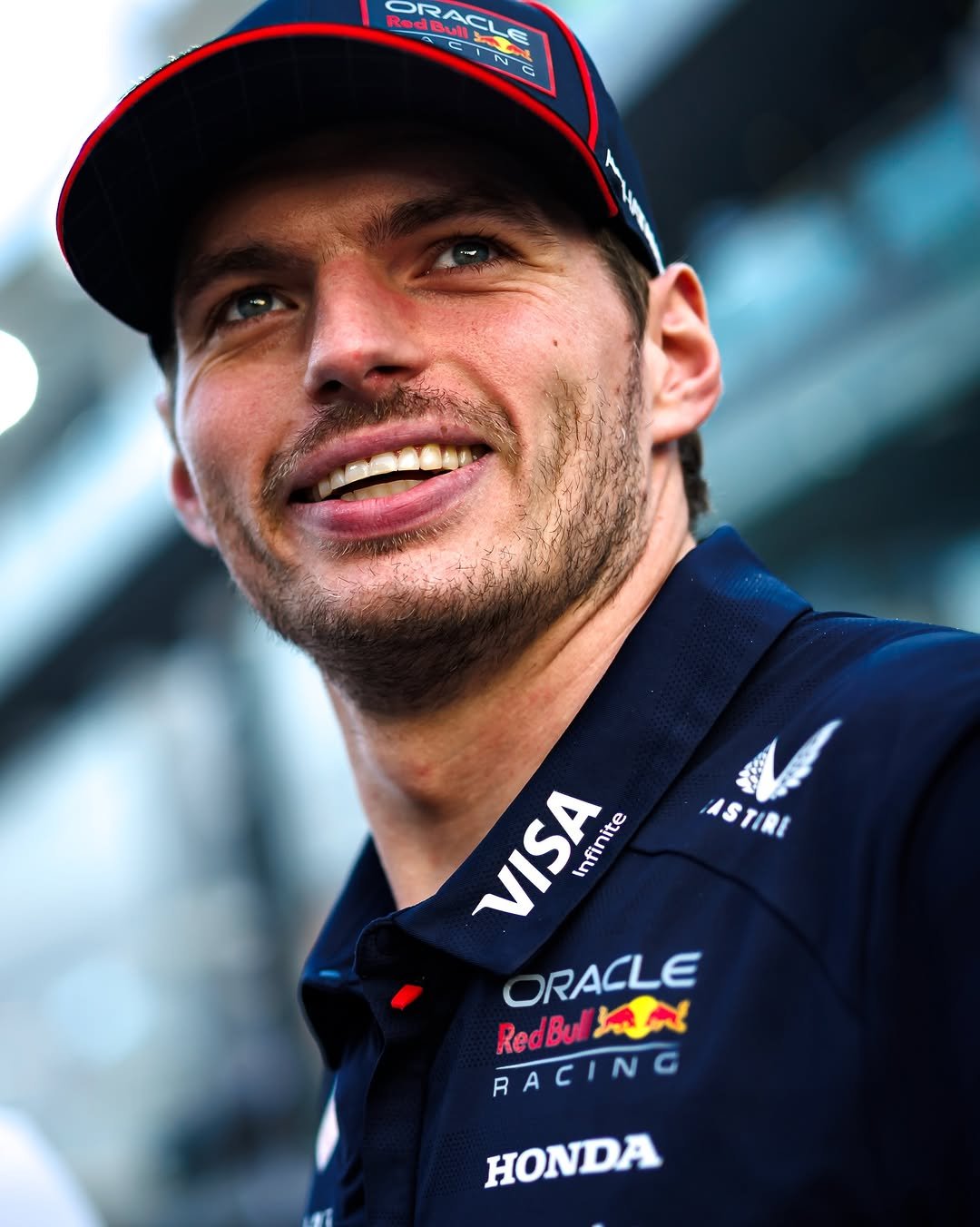 Photo by Max Verstappen in Yas Marina Circuit. May be an image of racing vehicles, helmet and text.