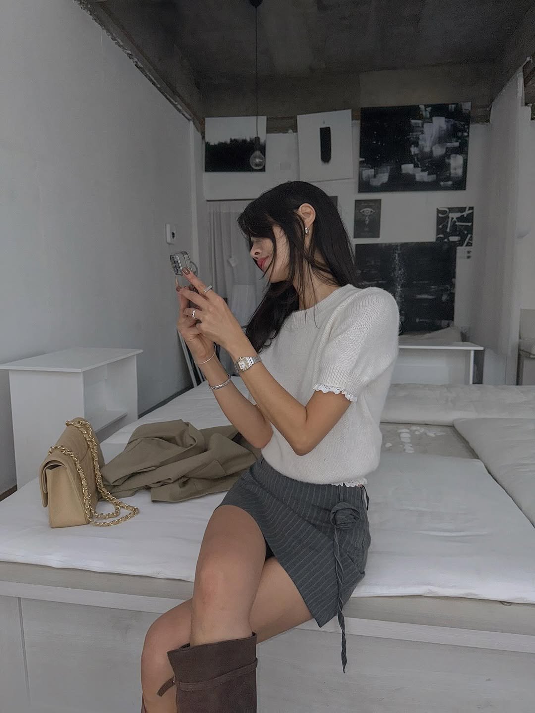 Photo by 메이메이 / maymay on September 29, 2025. May be an image of 1 person, braids, phone, boots, miniskirt and text.