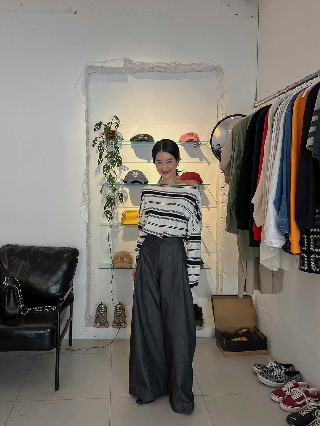 Photo by 메이메이 / maymay on August 12, 2025. May be an image of 1 person, top, clothes hanger, rack and text.