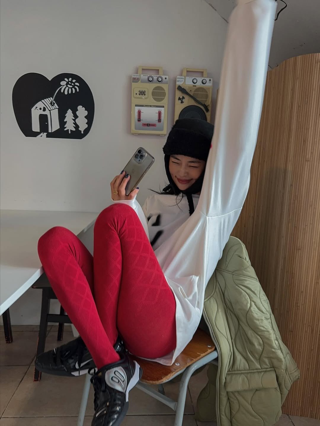 Photo by 메이메이 / maymay on November 06, 2025. May be an image of duffle coat, phone, tights, sweatpants, cornflower and text.