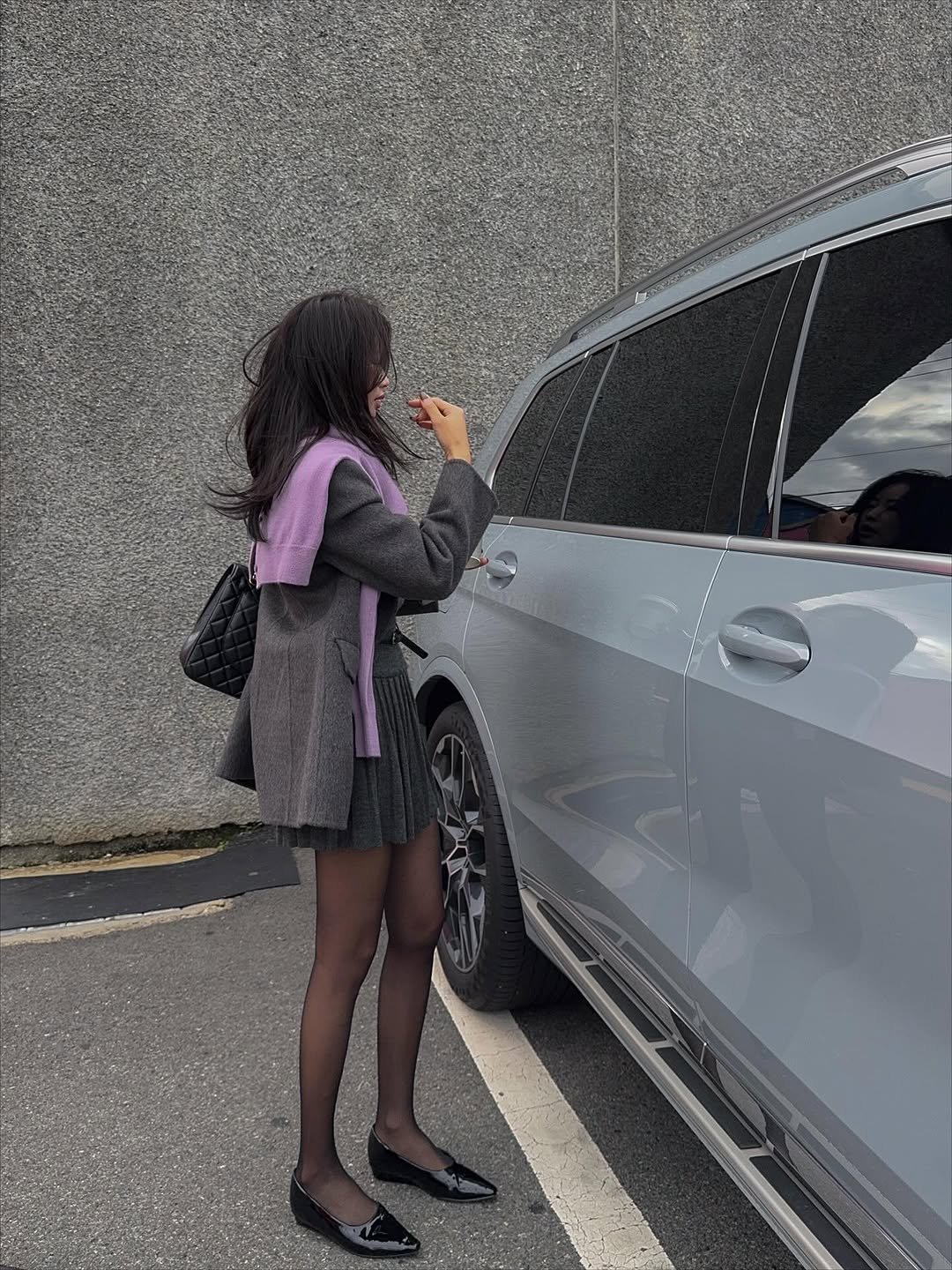 Photo by 메이메이 / maymay on October 25, 2025. May be an image of car, suit, tights, limousine, miniskirt and text.