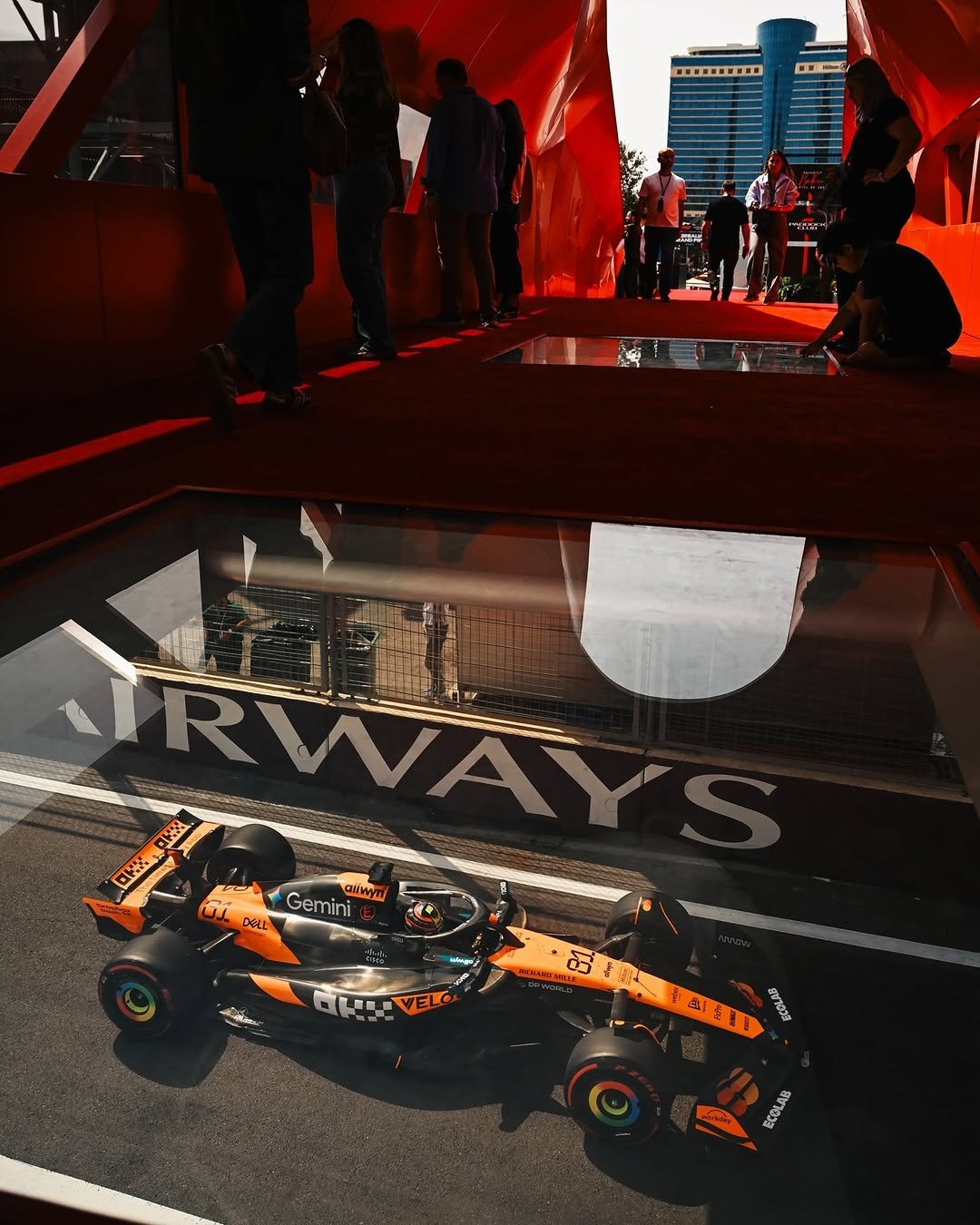 Photo by McLaren on September 23, 2025. May be an image of 10 people, people racing vehicles, race car and text.