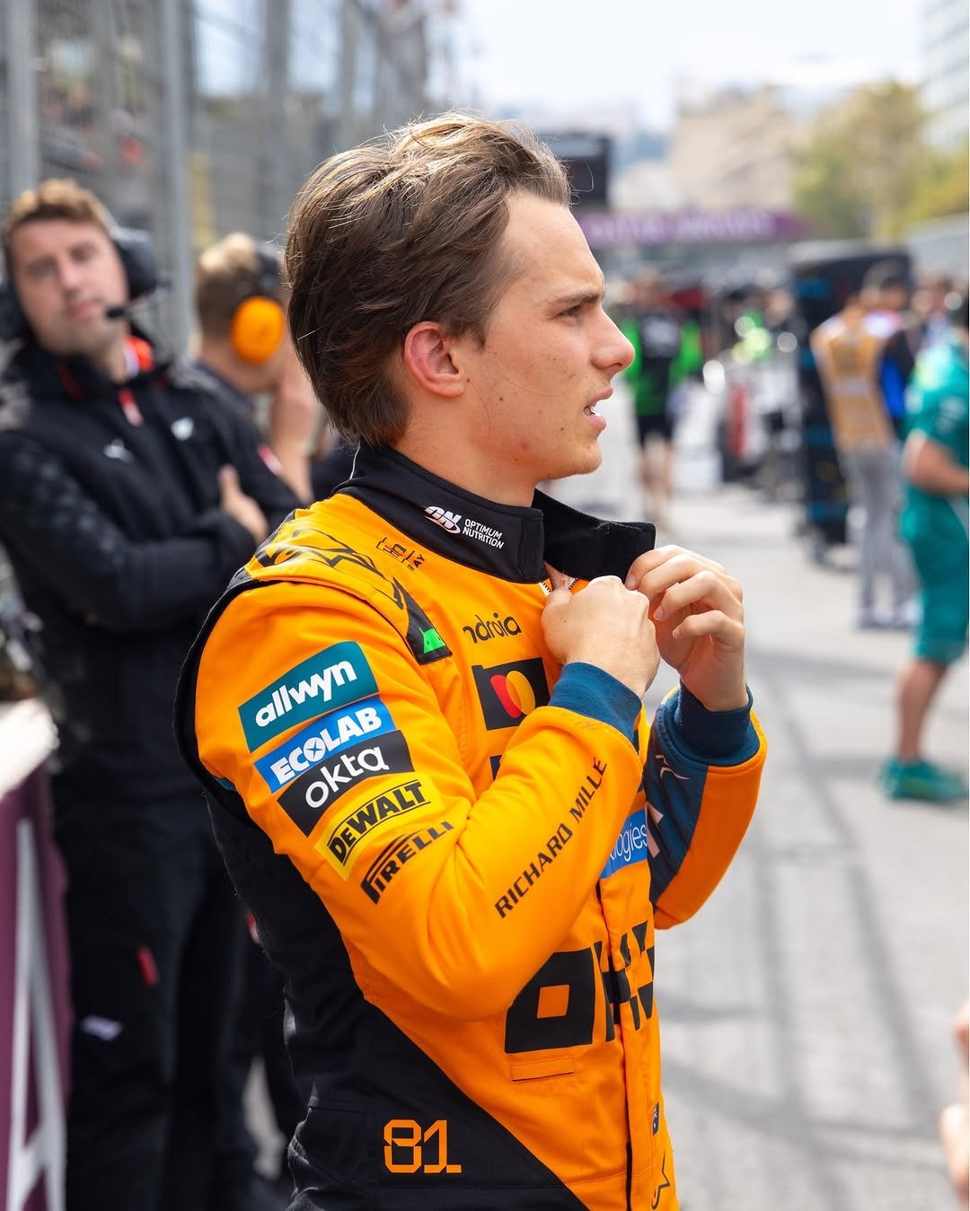Photo by McLaren on September 22, 2025. May be an image of 4 people, people racing vehicles, helmet and text.