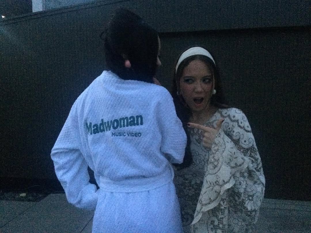 Photo shared by MEGAN MEI-YOK SKIENDIEL on April 25, 2026 tagging @laufey. May be an image of one or more people, sleepwear, bath robe, robe and text.