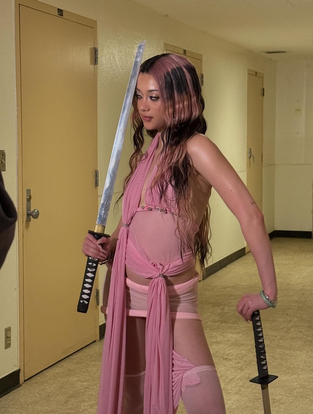 Photo by MEGAN MEI-YOK SKIENDIEL on April 16, 2026. May be an image of costume, sword, dagger and text.