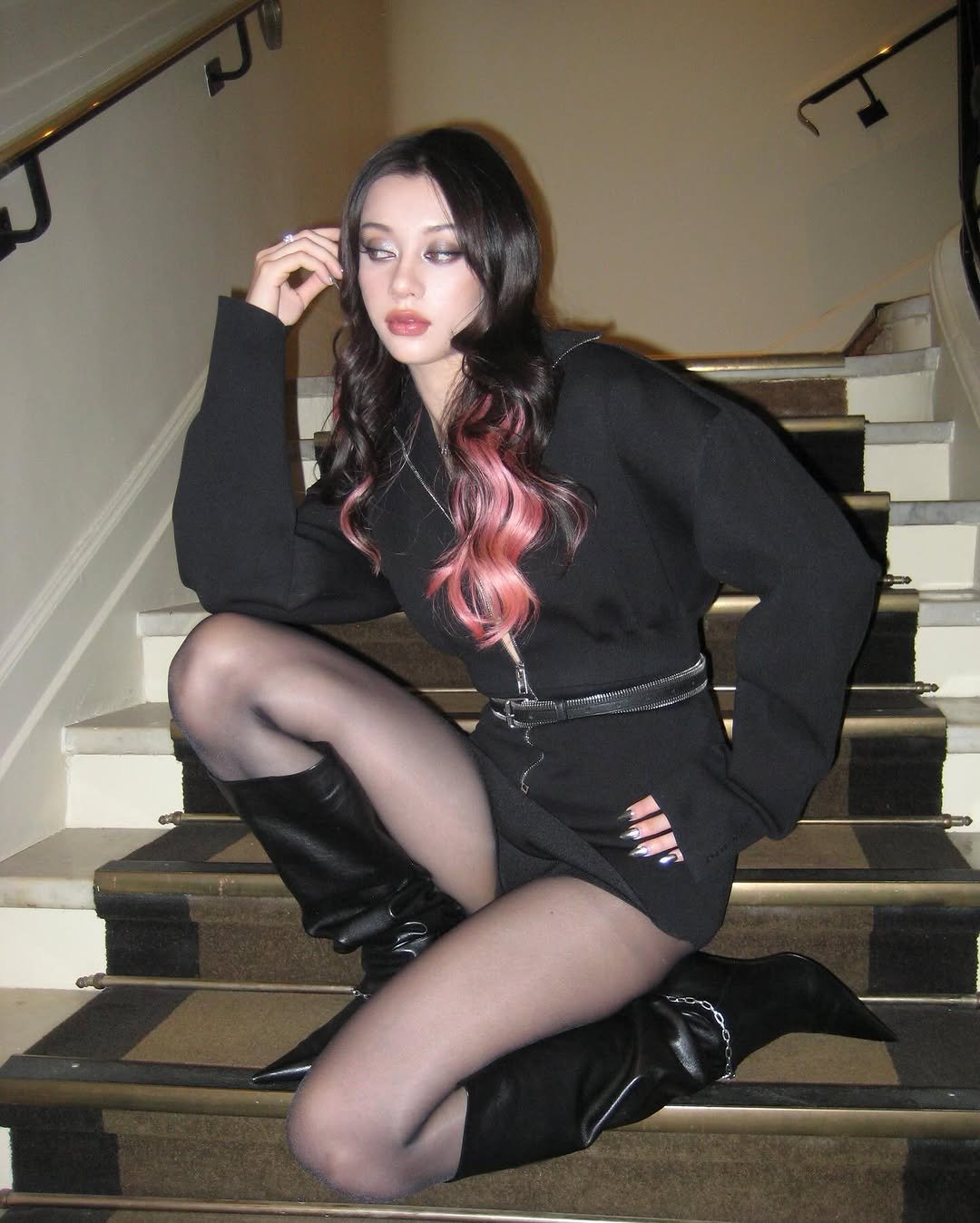 Photo shared by MEGAN MEIYOK SKIENDIEL on November 01, 2025 tagging @alexanderwangny. May be an image of one or more people, makeup, fishnet stockings, tights, miniskirt and text.