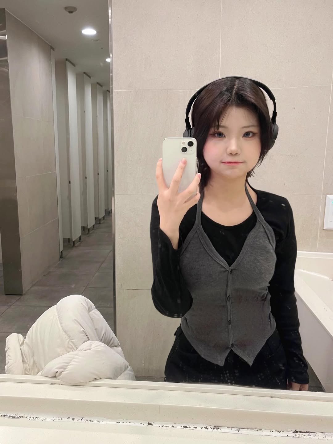 Photo by 채민 on January 12, 2026. May be a selfie of one or more people, hair, mirror, vest and text.