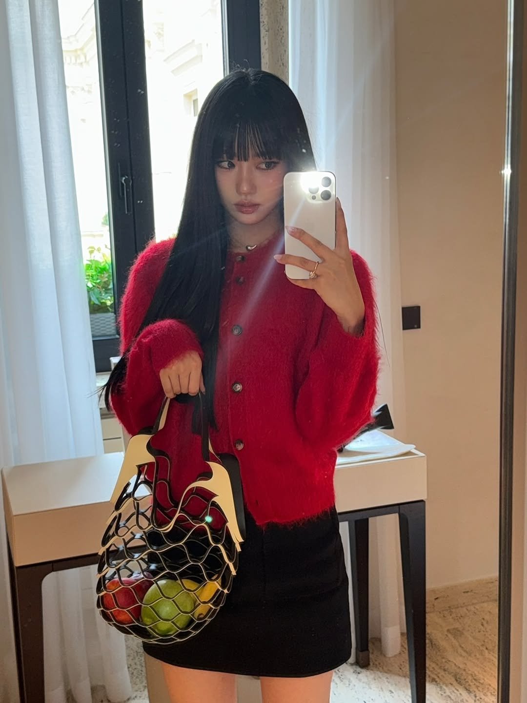 Photo by MEOVV on September 28, 2025. May be an image of 1 person, purse, miniskirt and text.