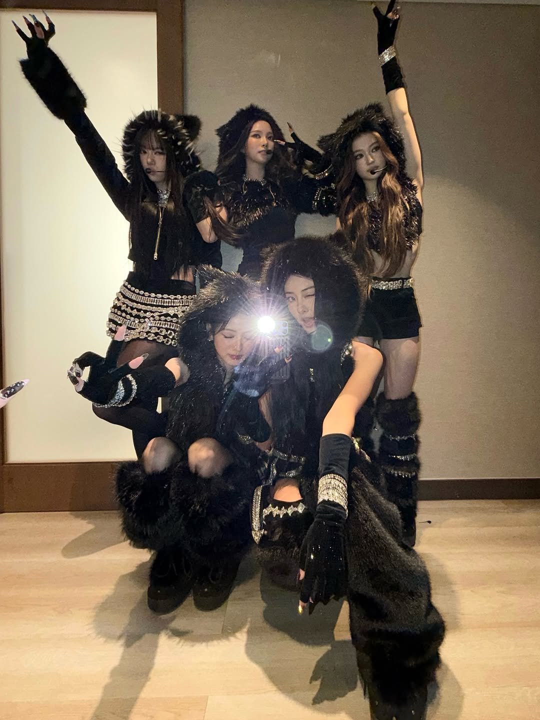 Photo by MEOVV on December 27, 2025. May be an image of dancing, costume and text.