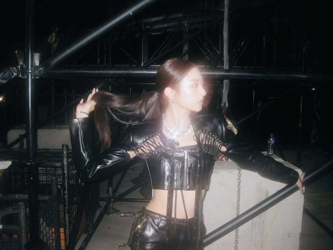 Photo by MEOVV on September 22, 2025. May be an image of 1 person, makeup, leather, fishnet stockings and text.