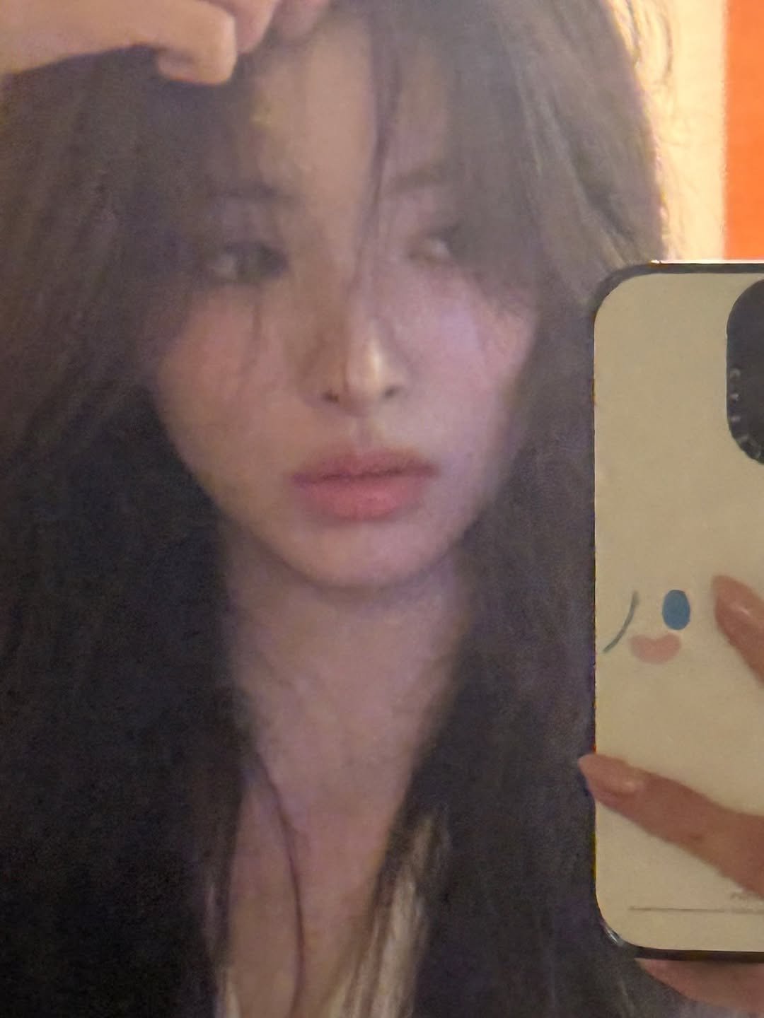 Photo by MEOVV on November 16, 2025. May be a selfie of one or more people, hair, phone, mirror and text.