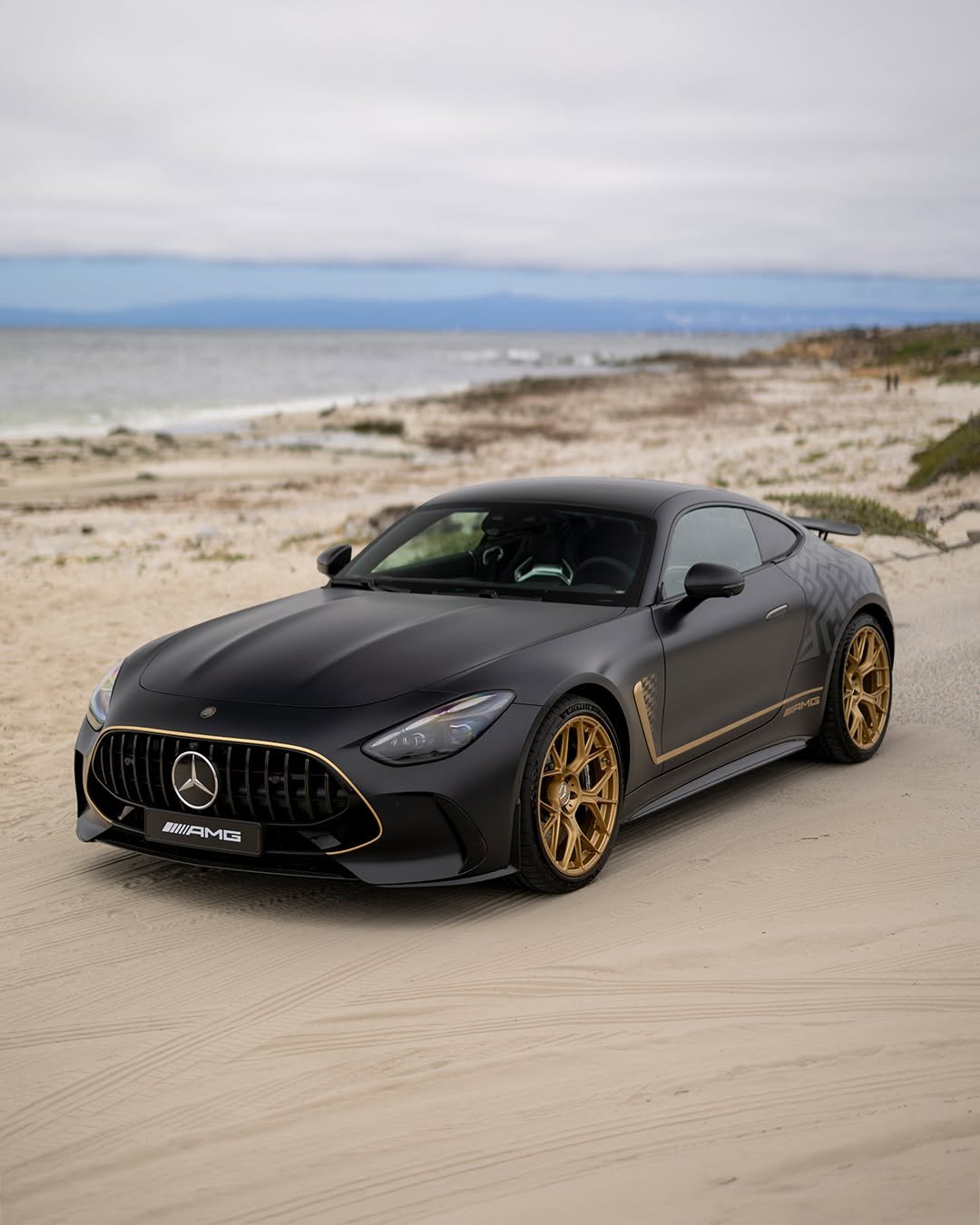 Photo shared by Mercedes-AMG on December 15, 2025 tagging @mercedesbenzusa. May be an image of wheel, race car, road and text.