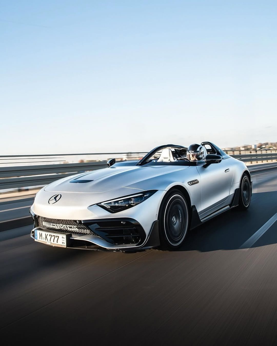 Photo by Mercedes-AMG on February 17, 2026. May be an image of car, convertible, roadster, wheel, road and text.