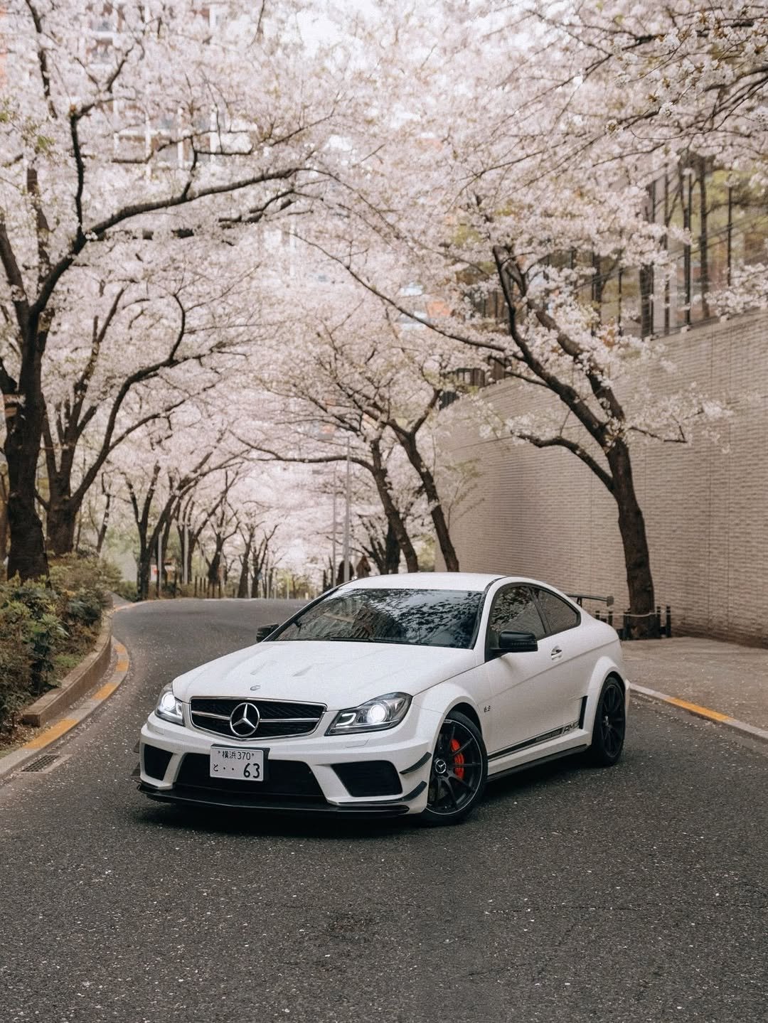 Photo by Mercedes-AMG on April 26, 2026. May be an image of wheel, race car, sedan, road and text.