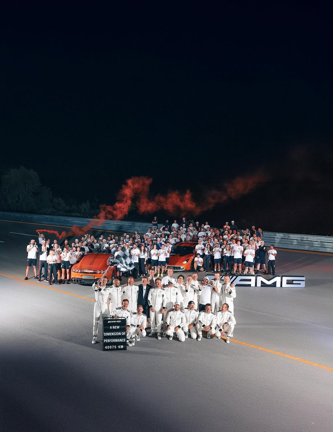Photo shared by Mercedes-AMG on August 24, 2025 tagging @mercedesbenz, @mercedesamgf1, @mercedesbenzusa, and @mercedesamgmotorsport. May be an image of 4 people, fire, road and text.