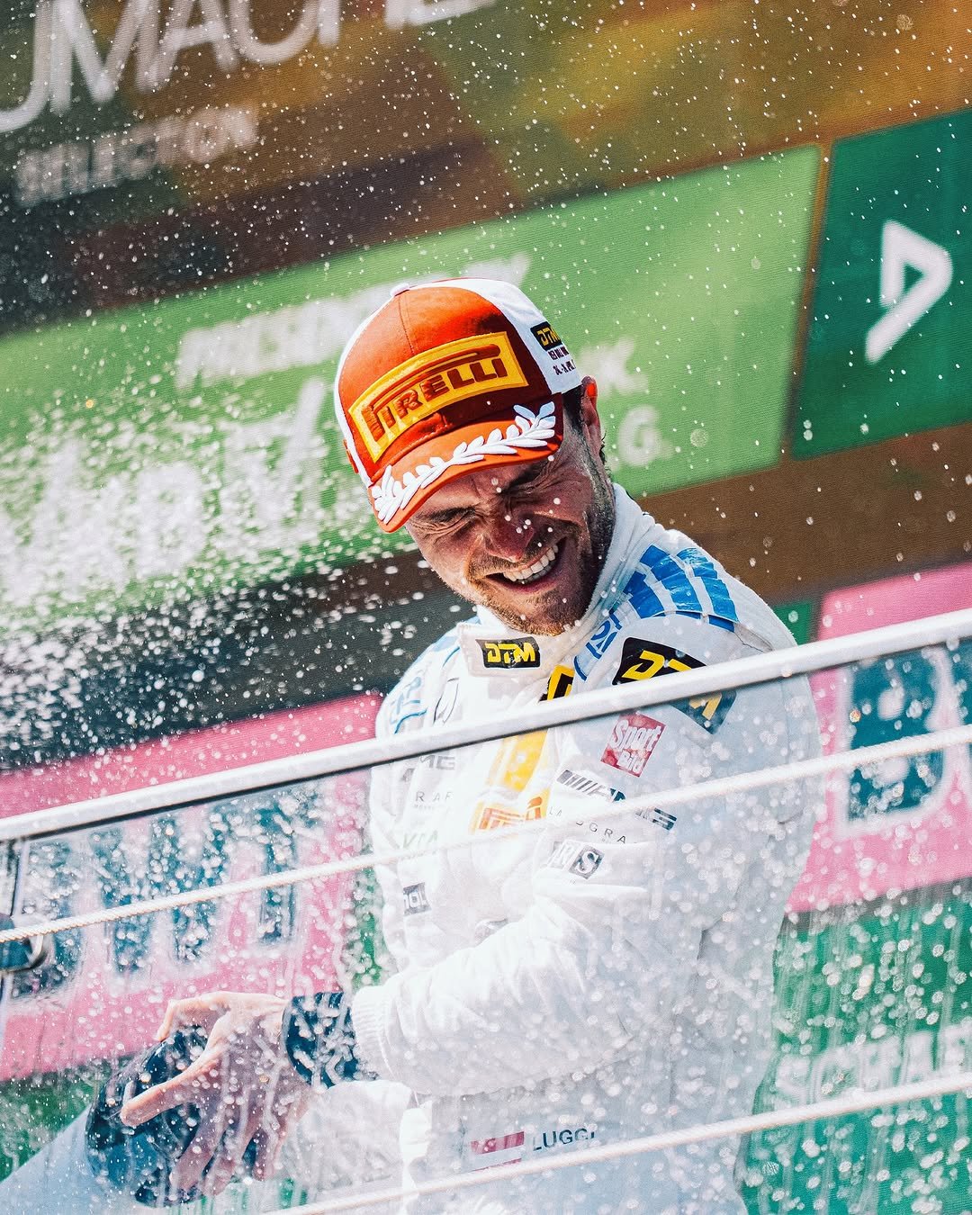 Photo shared by Mercedes-AMG Motorsport on April 26, 2026 tagging @pirelli_motorsport, @ompracing, @redbullring, @dtm.official, @luggiauer, @landgraf_group, and @adidasmotorsport. May be an image of racing vehicles, race car, helmet and text.