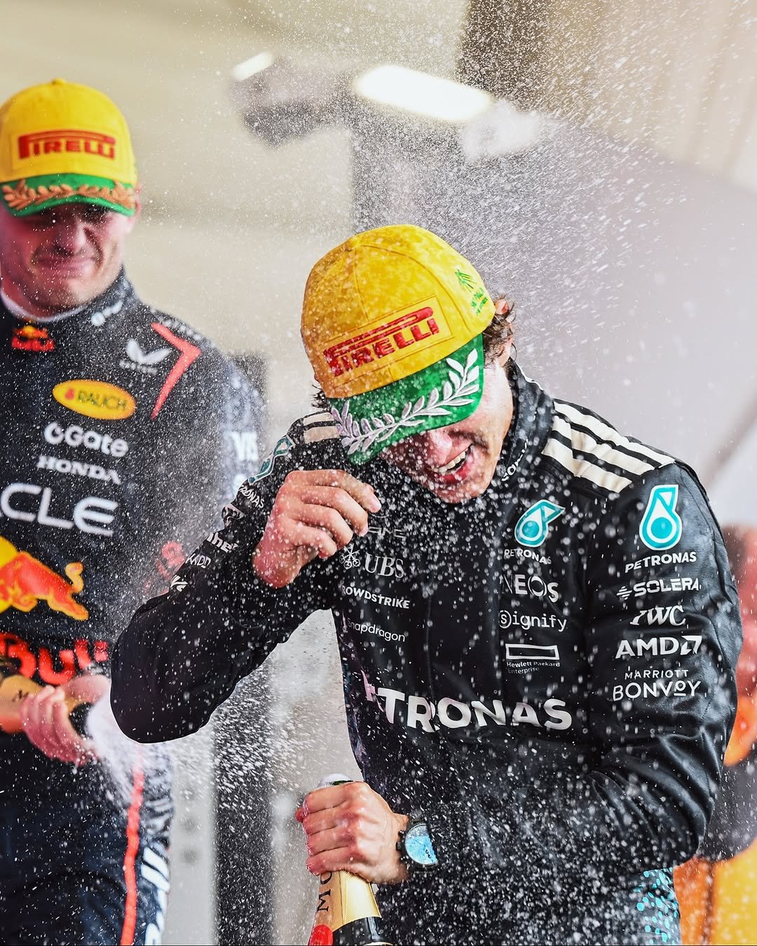 Photo shared by Mercedes-AMG Motorsport on November 09, 2025 tagging @mercedesamgf1, @mercedesamg, @mercedesbenzbrasil, @f1, and @kimi.antonelli. May be an image of racing vehicles, race car, helmet and text that says 'FRECU IRELLI 旅庭い SRALACH BALX GGate HONDA CLE បក ንሀ UBS NOWOSTRIKE 10W OWDSTRIKE pdragori C BERONA NEOS Dignify 8 PETRONAS TRONAS SCLERA ZWC AMDI7 MARRIOT MARRIOT BONVOY - TRONAS AS'.