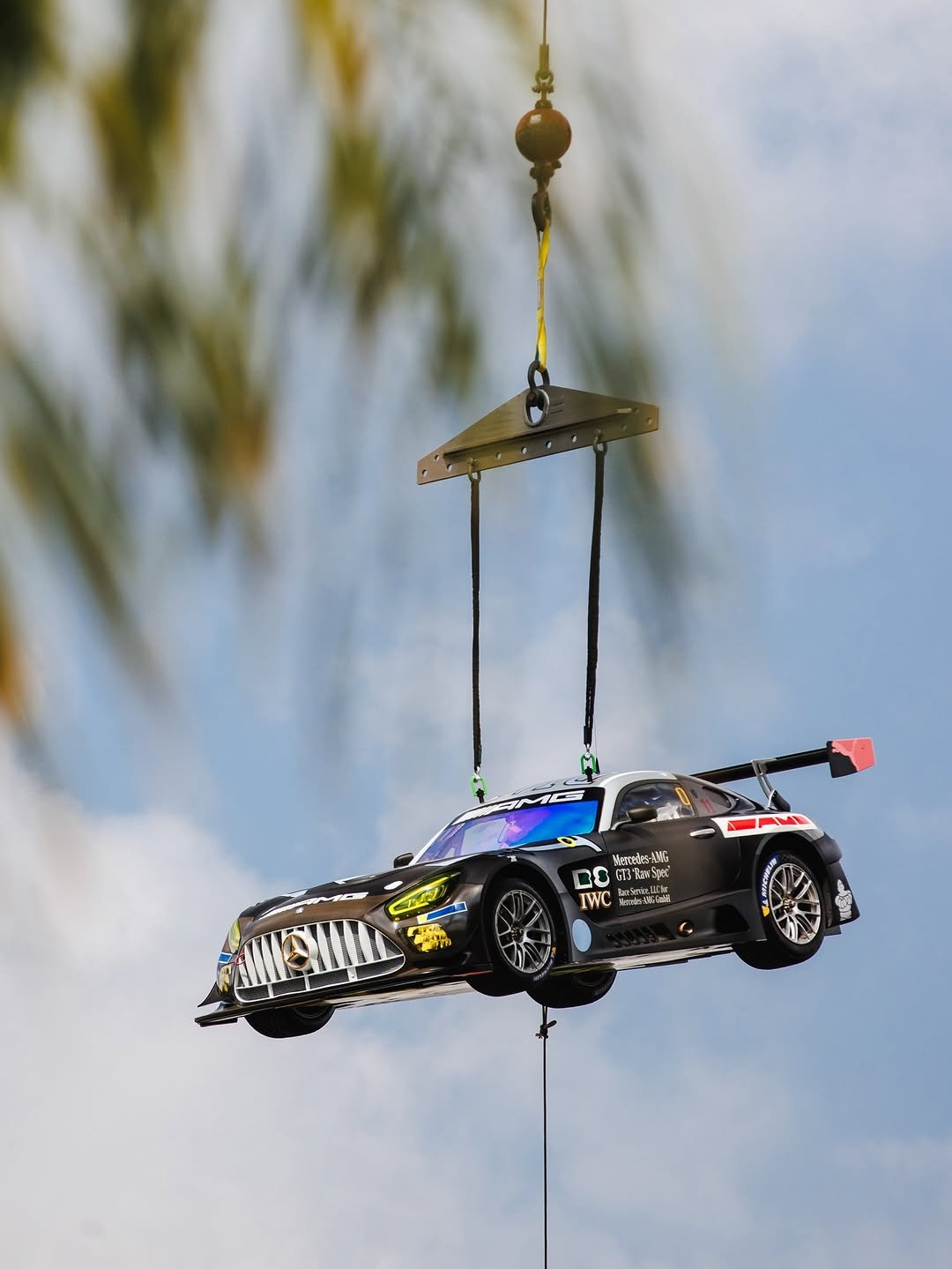 Photo shared by Mercedes-AMG Motorsport on February 23, 2026 tagging @mercedesamg, and @race.service. May be an image of skydiving, helicopter, parachute, race car and text.