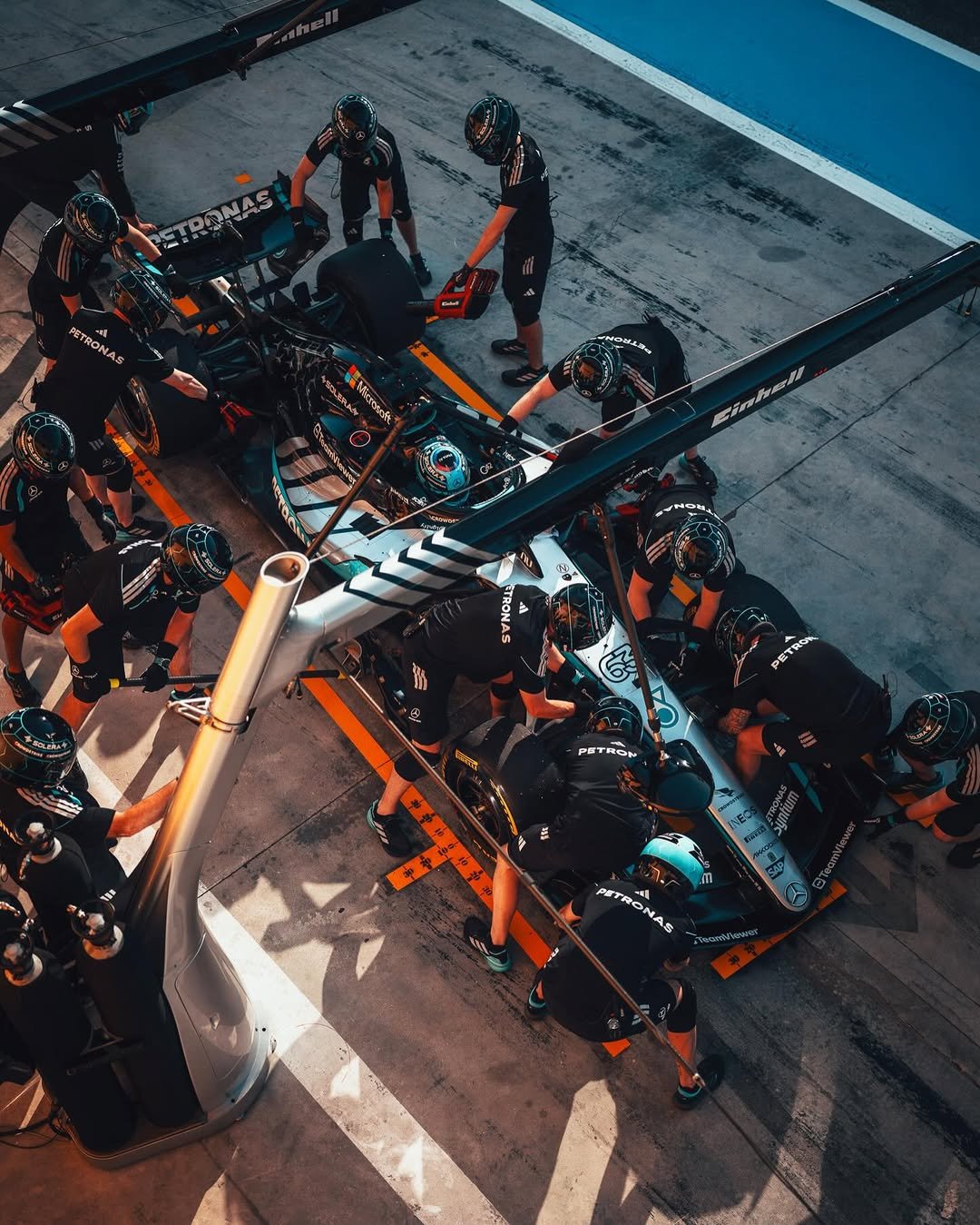 Photo shared by Mercedes-AMG Motorsport on February 20, 2026 tagging @mercedesamgf1, @bah_int_circuit, @mercedesamg, @georgerussell63, and @f1. May be an image of racing vehicles, helmet, crowd and text.