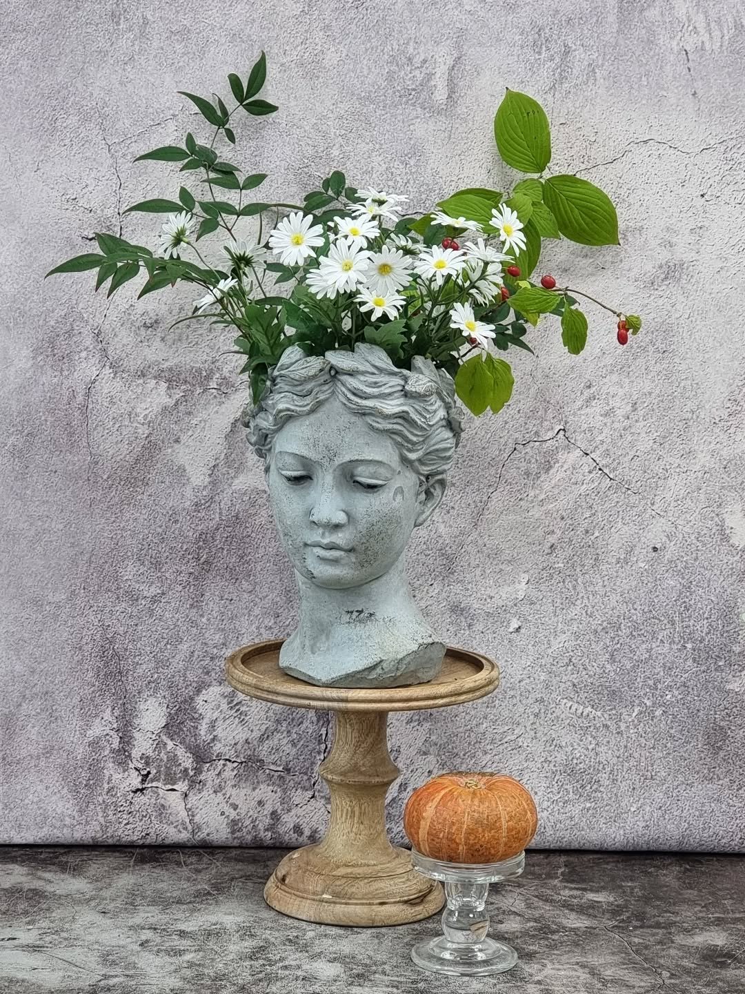 Photo by merry J on November 11, 2025. May be an image of flower arrangement, bust, urn and text.