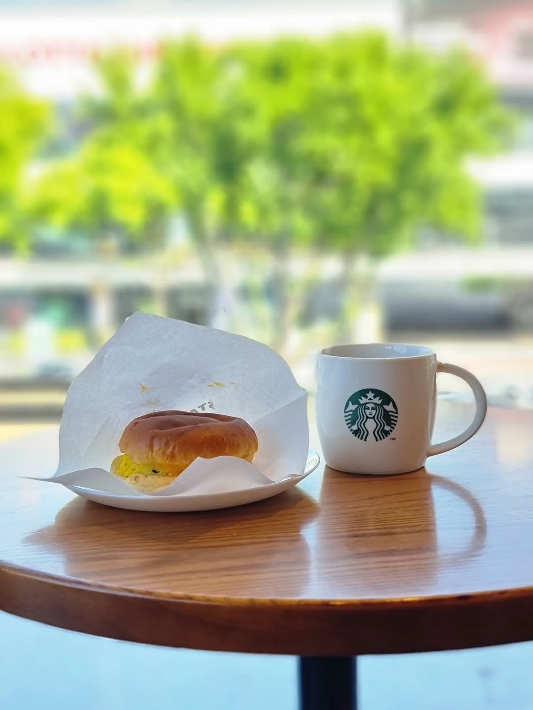 Photo by merry J on August 10, 2025. May be an image of coffee cup, cinnamon roll, croissant, bagel and text.