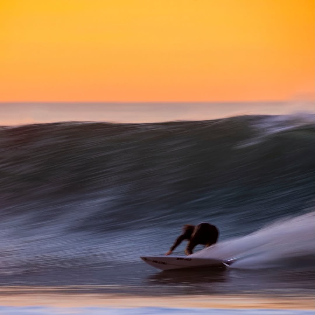 Photo by Mick Fanning on March 31, 2026. May be an image of surfboard, wetsuit, nature, water and text.