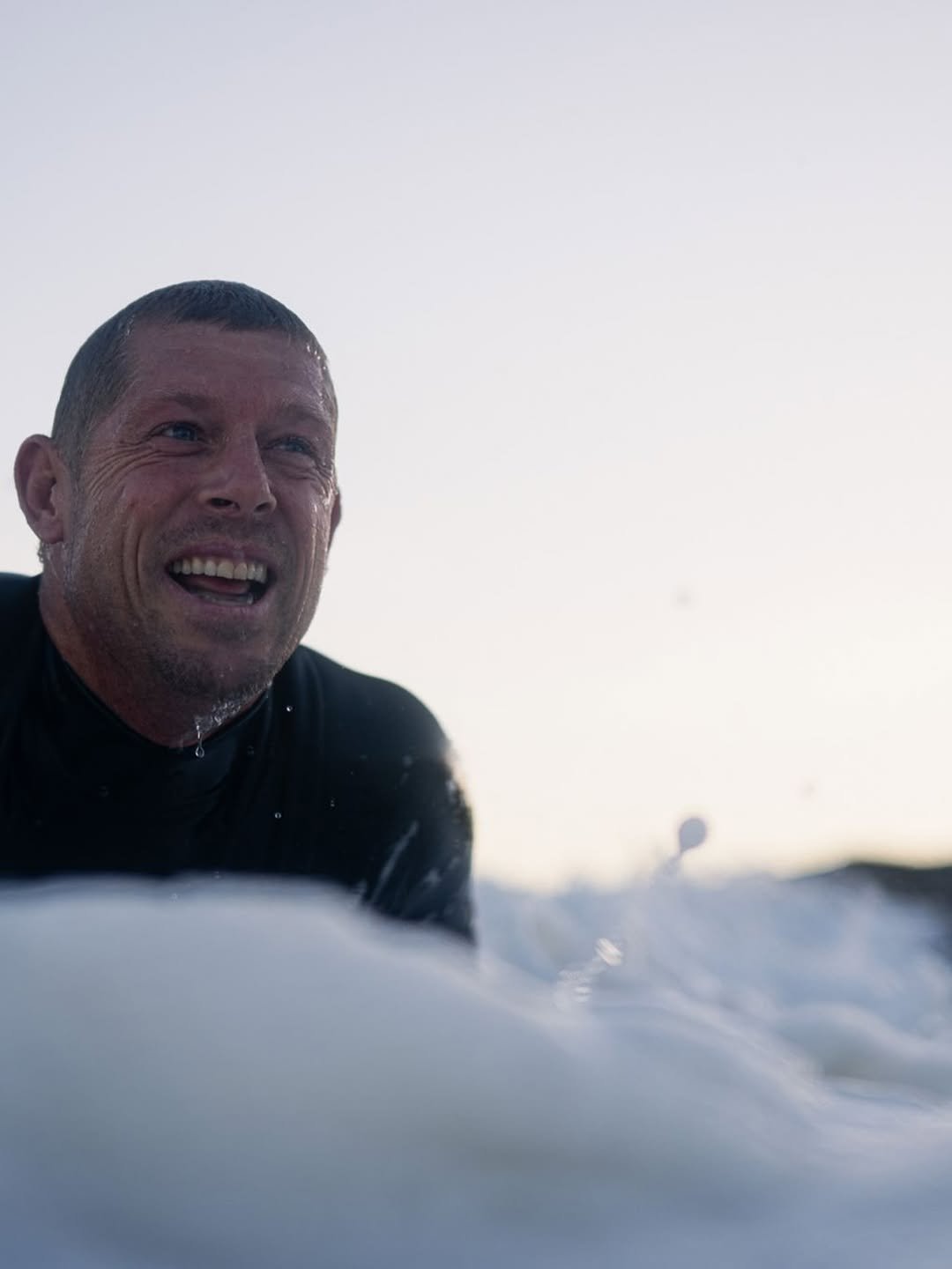 Photo by Mick Fanning on December 31, 2025. May be an image of surfboard, wetsuit and text.