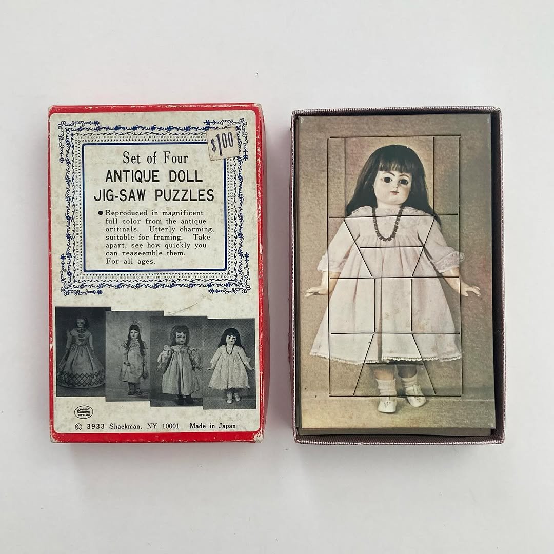 Photo by Micah Lexier on August 10, 2025. May be an image of 3 people, matchbook, cigarette case, box, shadow box, picture frame and text that says '焼吉日茶 $100 Set of Four ANTIQUE DOLL JIG-SAW JIG-SAWPUZZLES PUZZLES •Repraduredir ritinale ullcolor Litterhe Utterly barming, barminu o suitable Fram -Framing ህ Takr DEANT quickl you ou reaseemble For them. 2m 03fheire1Kode C 3933 Shackman, NY 10001 Made Japan'.