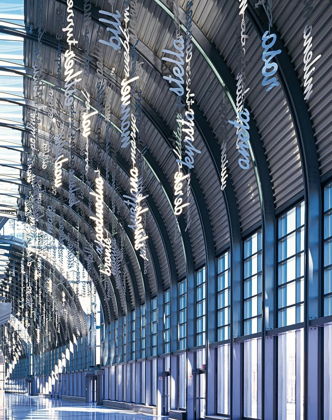 Photo by Micah Lexier on September 26, 2025. May be an image of buildings, terminal, hallway and text.