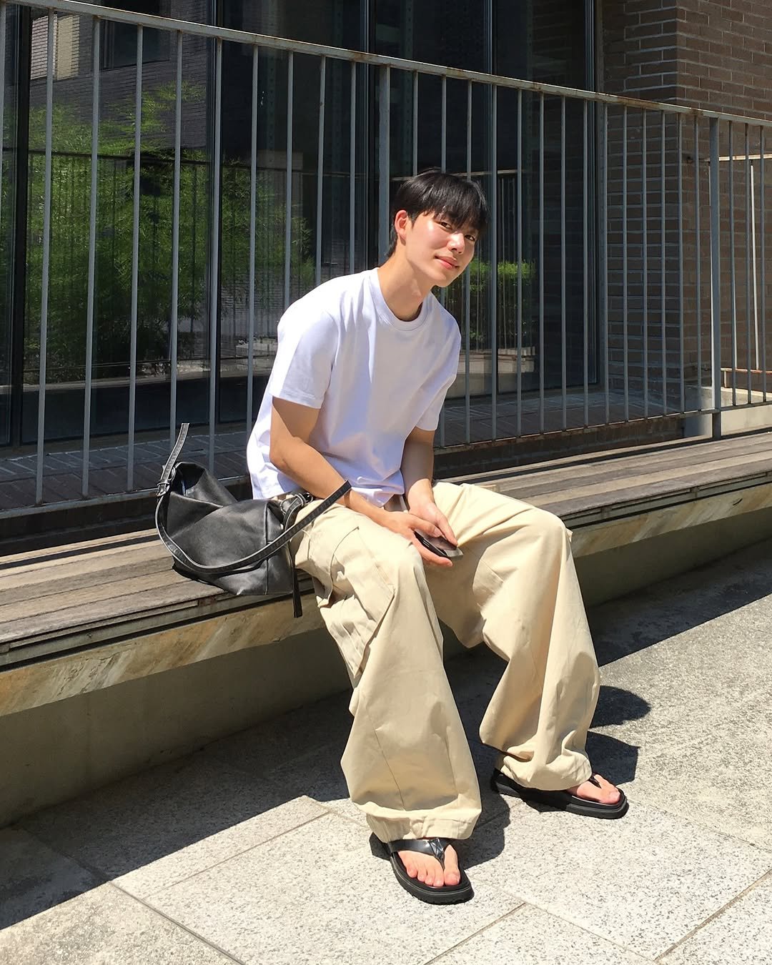 Photo by 미지로 on July 23, 2025. May be an image of 1 person, shorts, sweatpants and text.