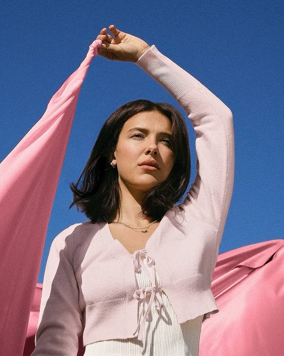 Photo shared by Millie Bobby Brown on January 08, 2026 tagging @walmart, and @walmartstyle. May be an image of one or more people, turtleneck and text.