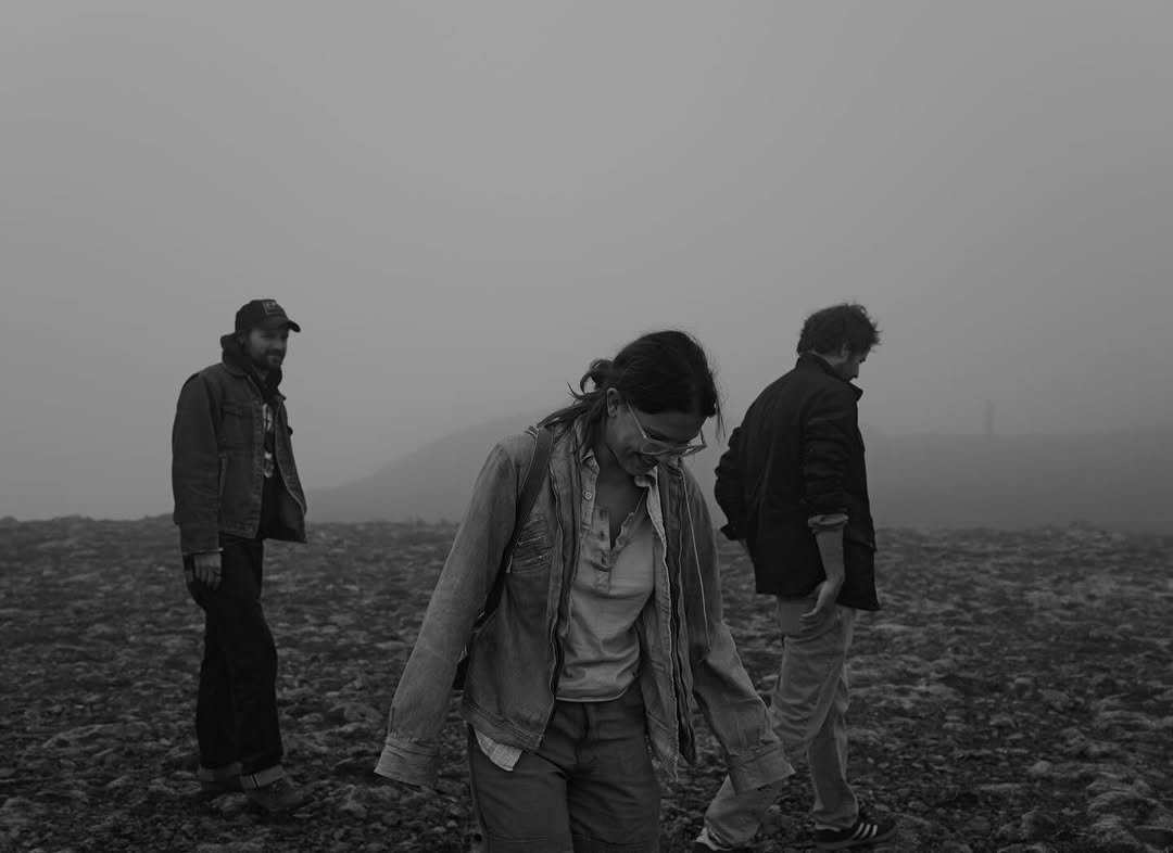 Photo by Millie Bobby Brown on December 31, 2025. May be a black-and-white image of one or more people, people standing, fog, outdoors and text.