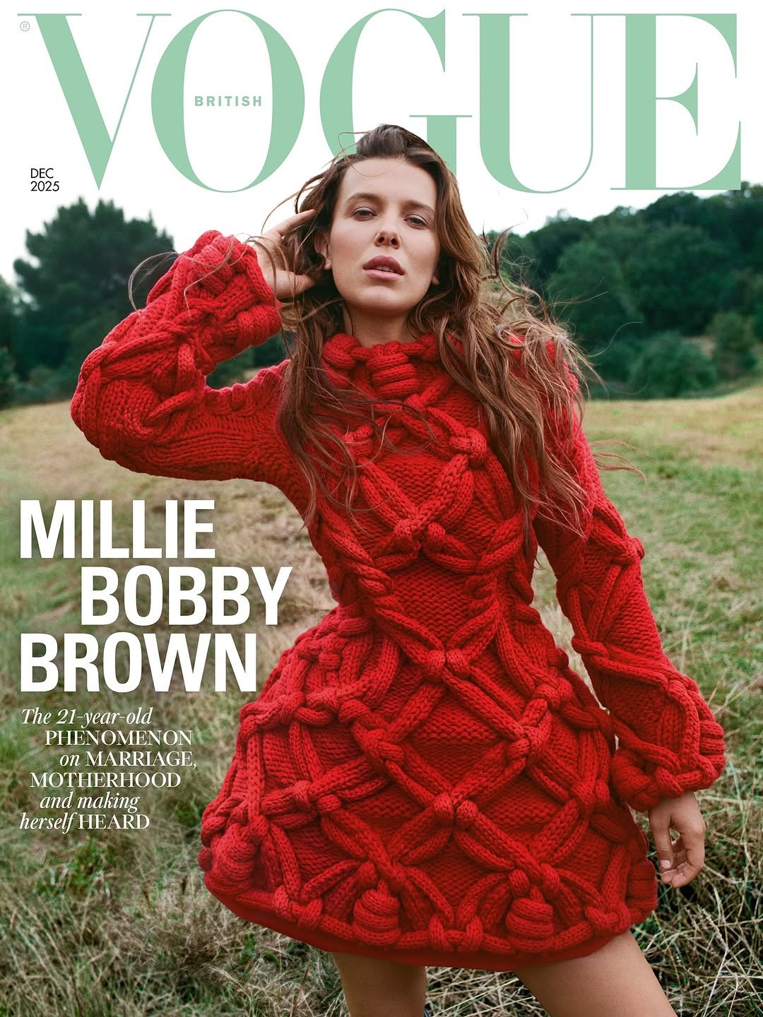 Image shows Millie Bobby Brown standing in a field wearing a short red knitted dress with long sleeves. Her long brown hair is loose and she has her right hand behind her head. Above her head, the word Vogue in pale green letters. The cover line reads: “Millie Bobby Brown: The 21-year-old phenomenon on marriage, motherhood and making herself heard.”]